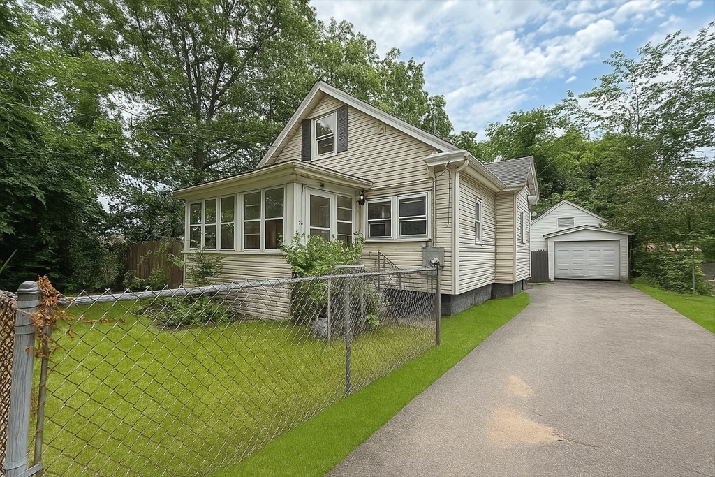 23 Eldert Street Springfield, MA 01109 - Photo 4 of 27 a view of house with a yard and sitting area