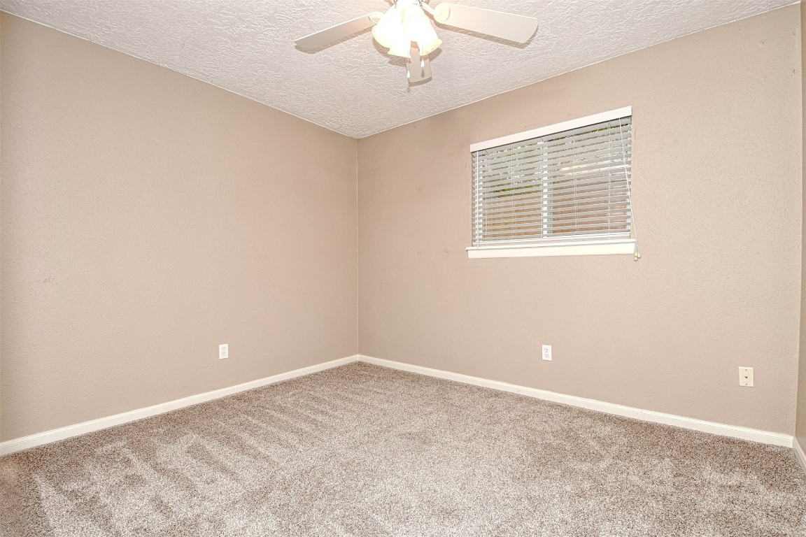 518 Moore Street Tomball, TX 77375 - Photo 11 of 18 a view of an empty room with a window