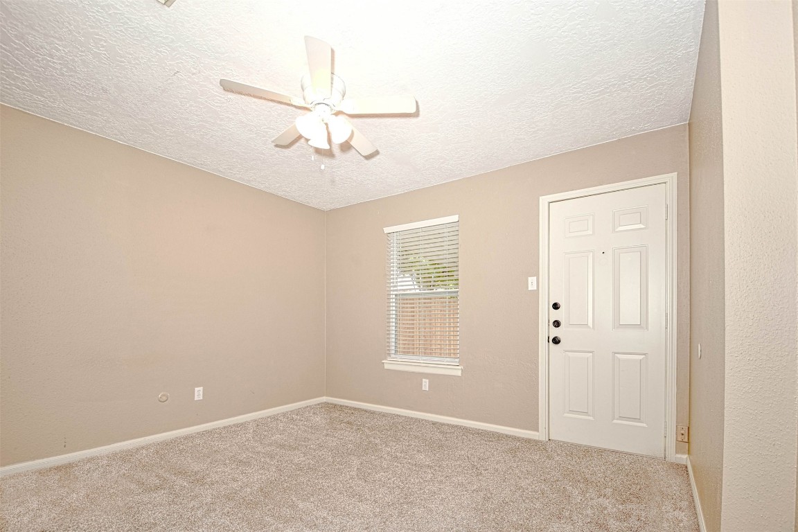 518 Moore Street Tomball, TX 77375 - Photo 13 of 18 a view of an empty room with a window