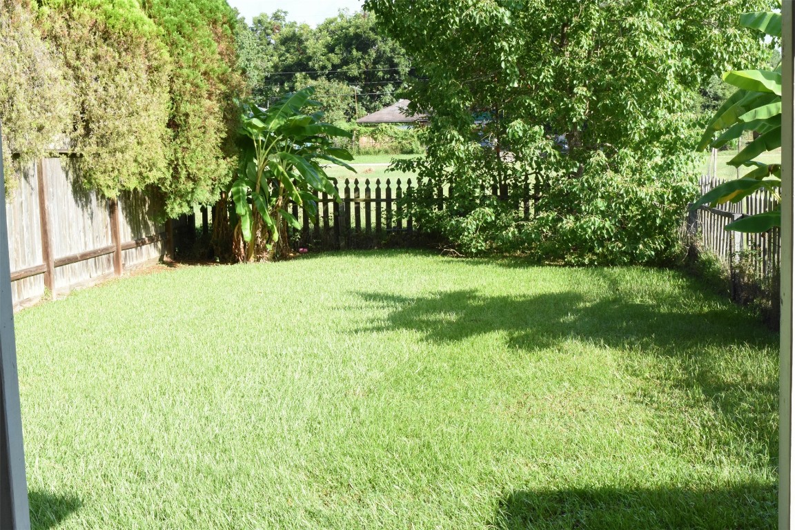 518 Moore Street Tomball, TX 77375 - Photo 18 of 18 a view of an outdoor space and a yard
