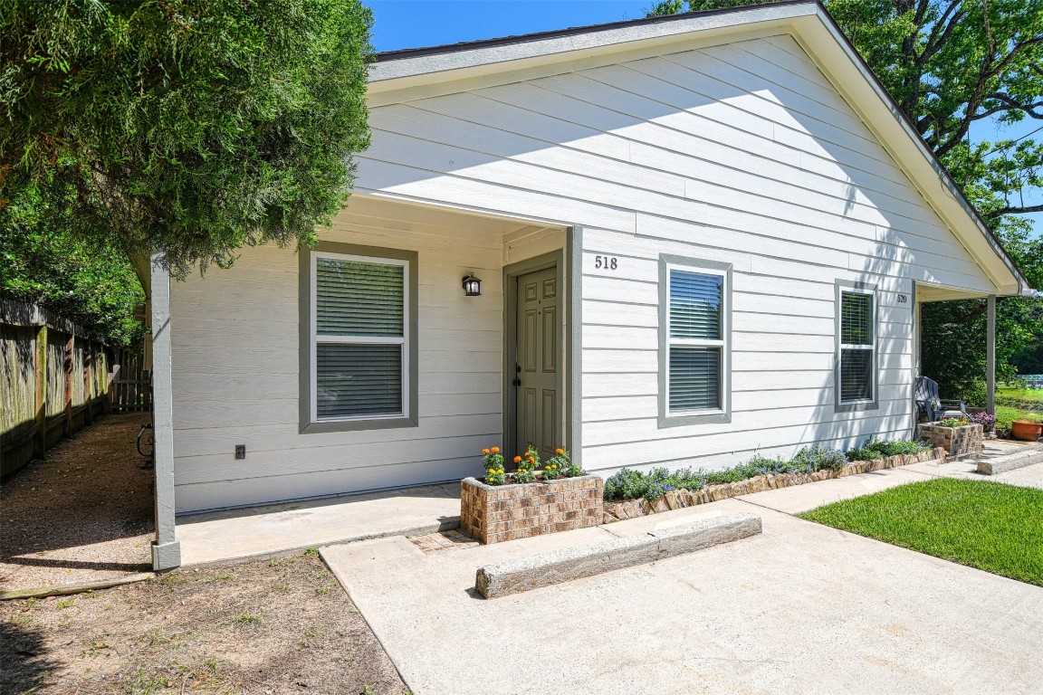 518 Moore Street Tomball, TX 77375 - Photo 3 of 18 a front view of a house with a yard