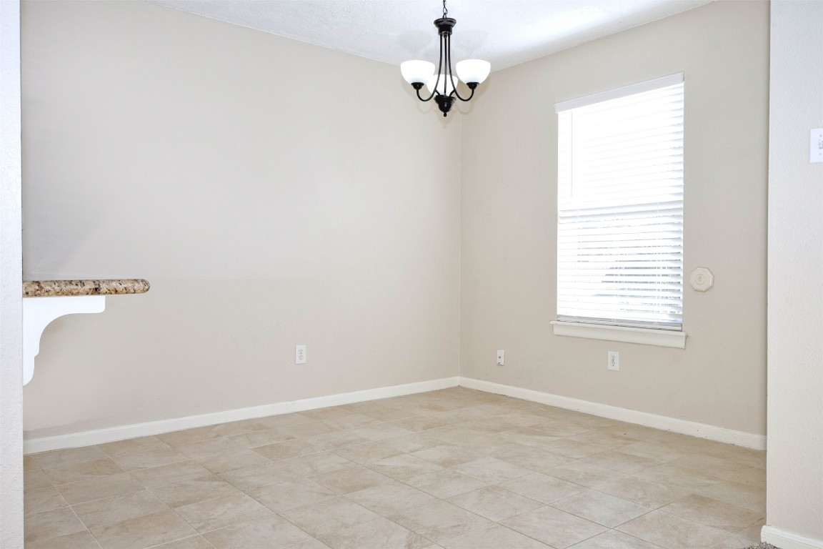 518 Moore Street Tomball, TX 77375 - Photo 6 of 18 an empty room with a window