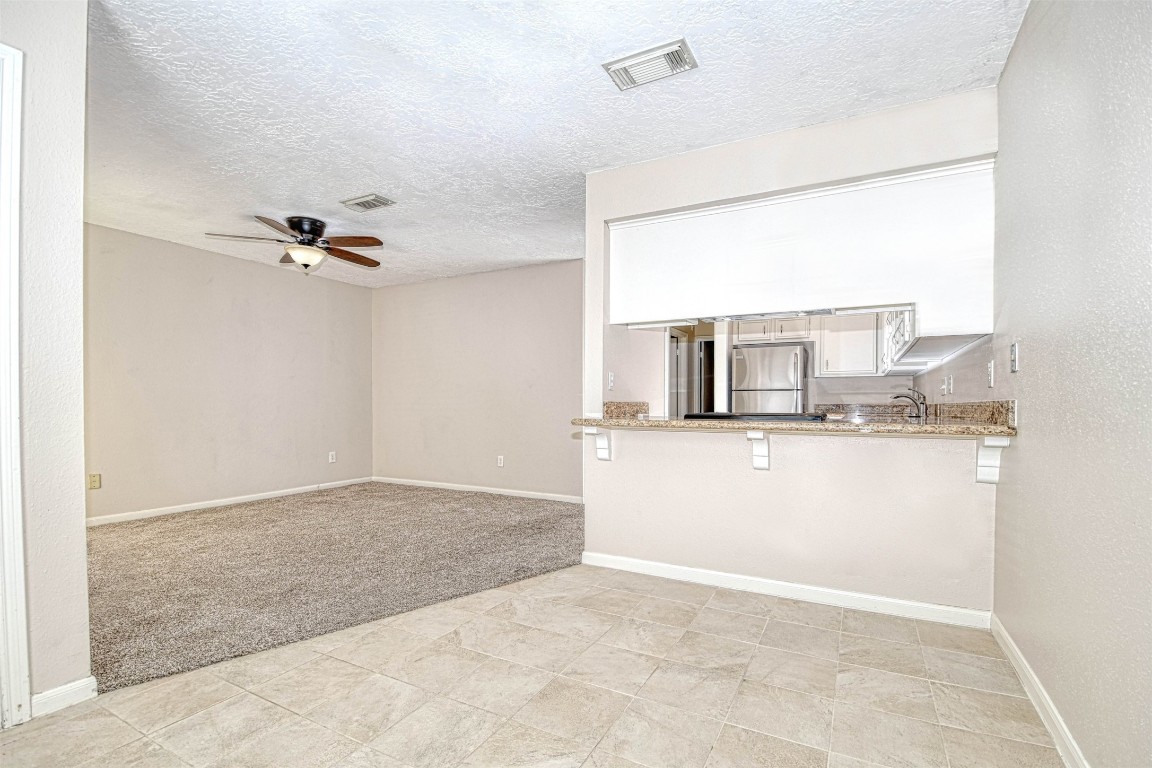 518 Moore Street Tomball, TX 77375 - Photo 8 of 18 a view of a room with a sink and mirror
