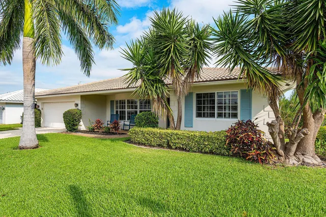 a front view of house with yard and porch