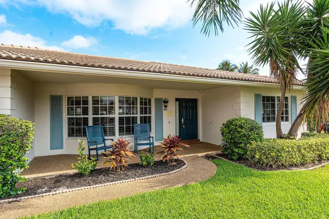 a front view of house with yard and seating space
