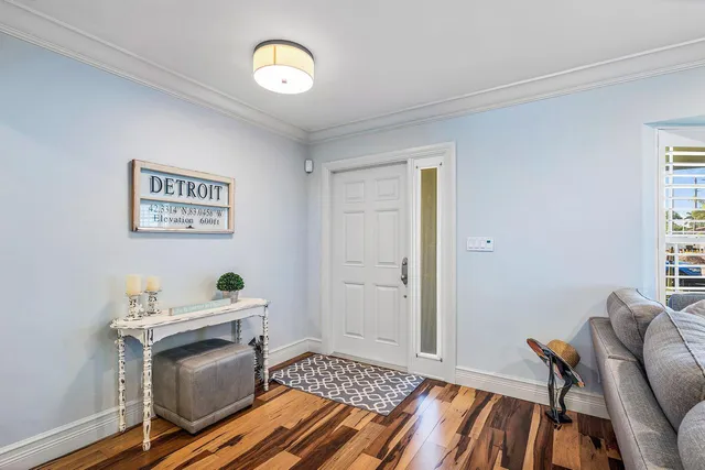 a view of a livingroom with furniture and staircase