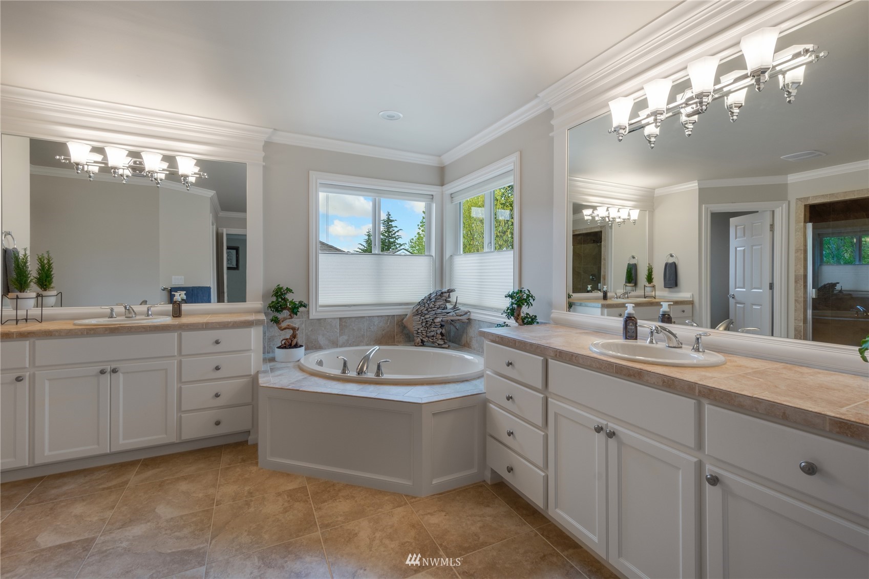 4123 221st Place Southeast Bothell, WA 98021 - Photo 16 of 28 a spacious bathroom with a double vanity sink mirror and bathtub
