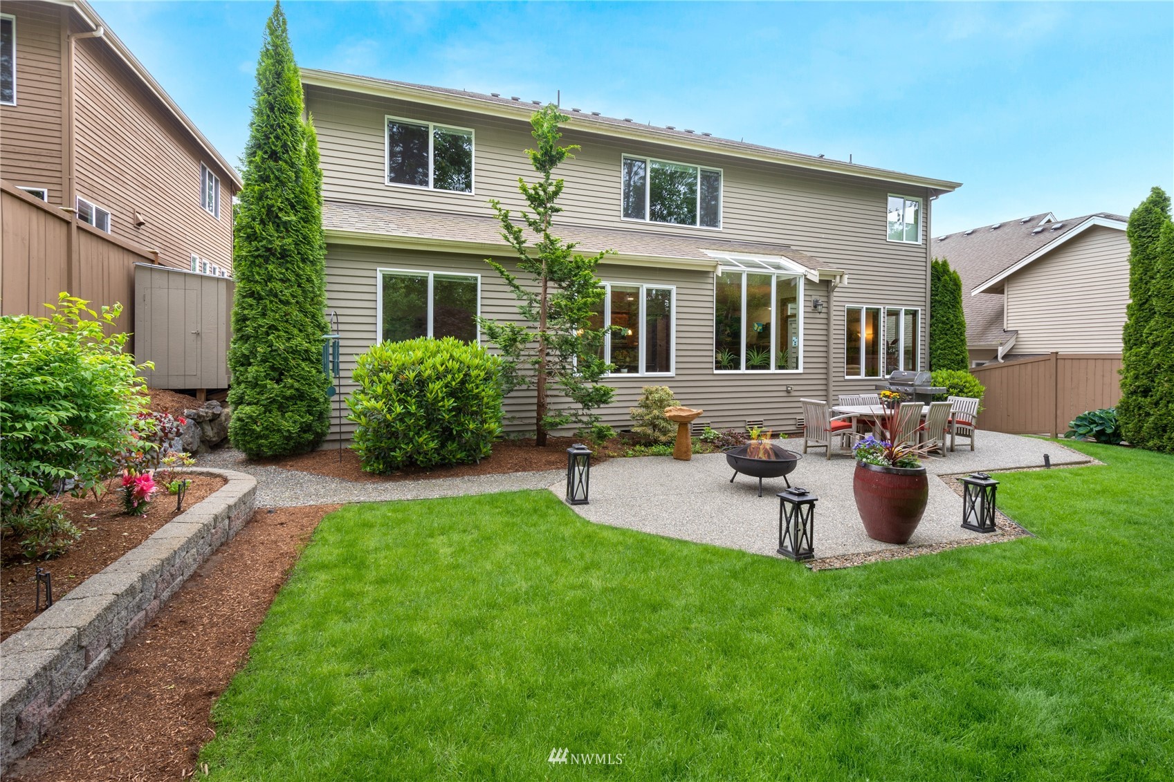 4123 221st Place Southeast Bothell, WA 98021 - Photo 25 of 28 a front view of house with a garden and patio