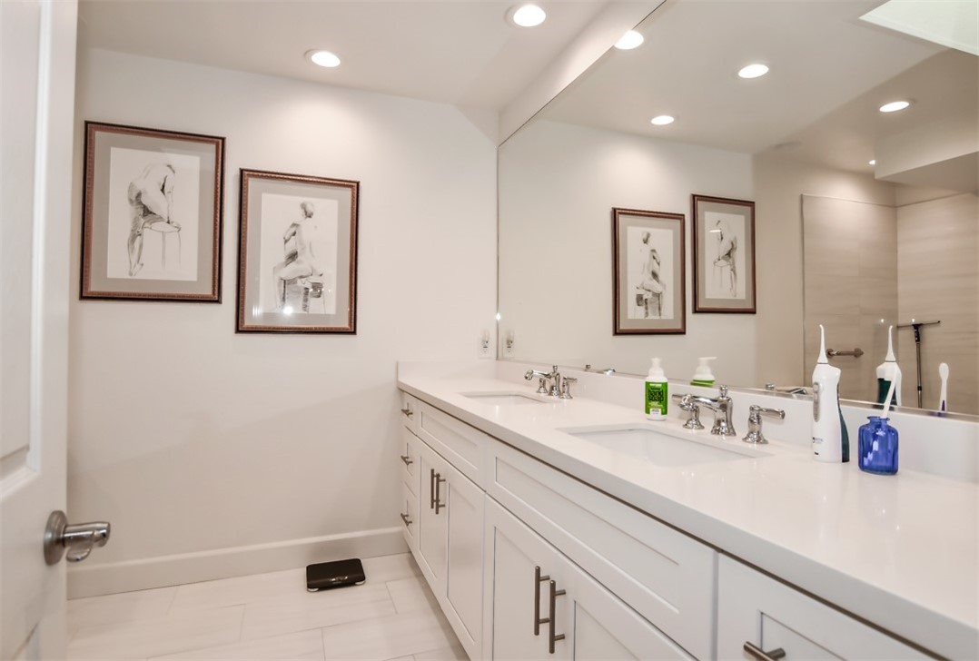26 Shoal Drive Corona del Mar, CA 92625 - Photo 25 of 37 a bathroom with a sink a mirror and a toilet