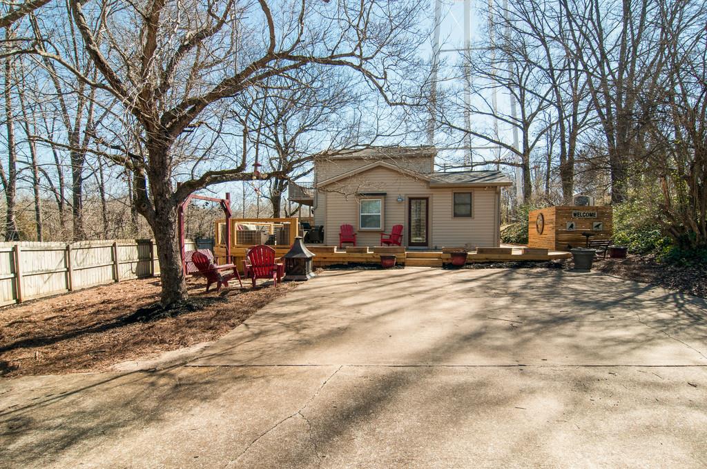 7214 Sleepy Hollow Road Fairview, TN 37062 - Photo 1 of 28 a view of a house with a yard covered in snow