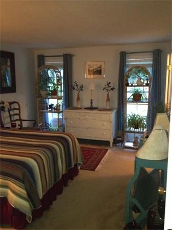 42 Old Stage Road Hatfield, MA 01088 - Photo 18 of 28 a bedroom with a bed lamps and window
