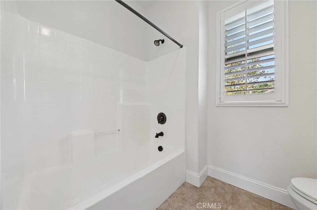 21 Canoe Irvine, CA 92618 - Photo 14 of 61 a bathroom with a bathtub and a shower