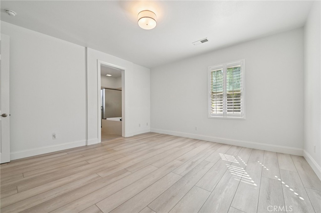 21 Canoe Irvine, CA 92618 - Photo 35 of 61 an empty room with wooden floor and windows