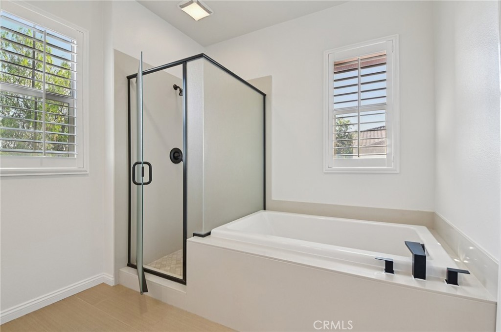 21 Canoe Irvine, CA 92618 - Photo 37 of 61 a bathroom with a bathtub and a shower