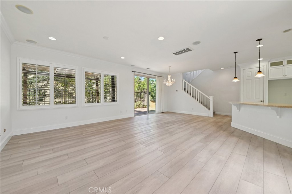 21 Canoe Irvine, CA 92618 - Photo 4 of 61 an empty room with wooden floor and windows