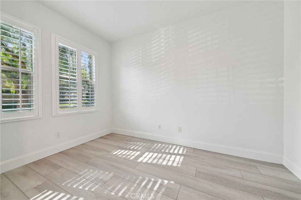 21 Canoe Irvine, CA 92618 - Photo 42 of 61 an empty room with wooden floor and windows