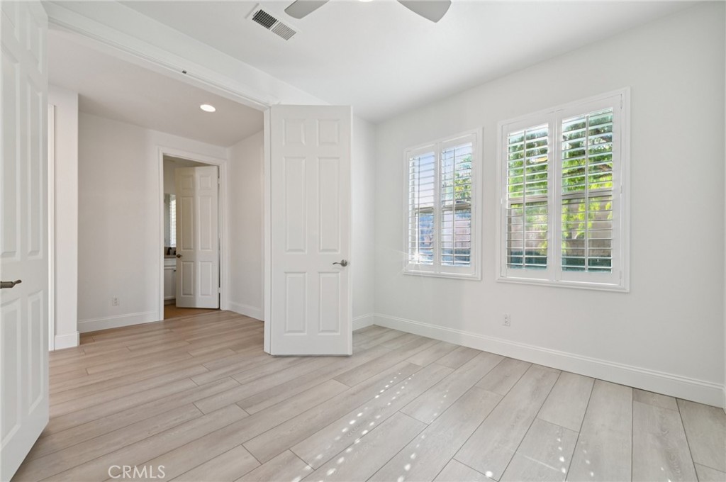 21 Canoe Irvine, CA 92618 - Photo 45 of 61 an empty room with wooden floor and windows