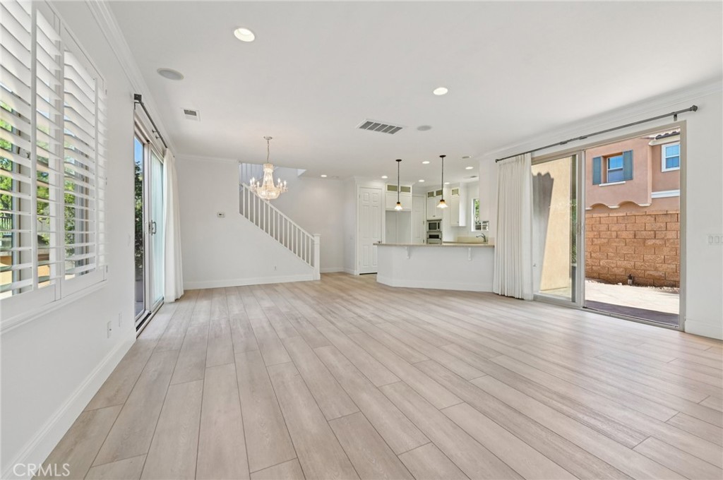 21 Canoe Irvine, CA 92618 - Photo 5 of 61 an empty room with wooden floor and windows