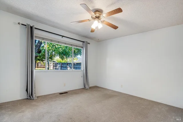 a kitchen that has a lot of cabinets in it