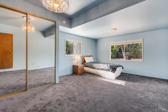 a street sign on the side of the house