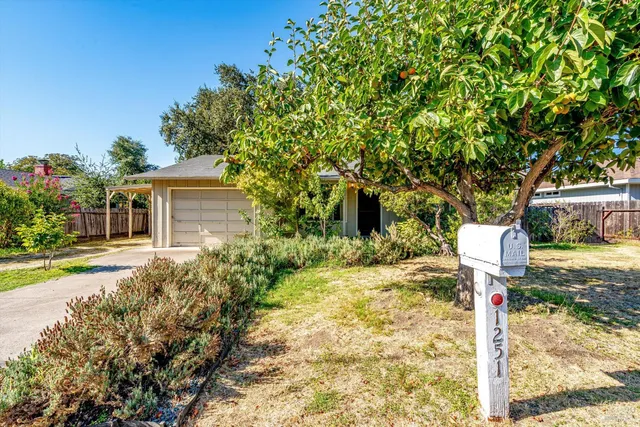 a aerial view of a residential apartment building with a yard