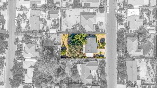 a view of a lake with a bench and trees around