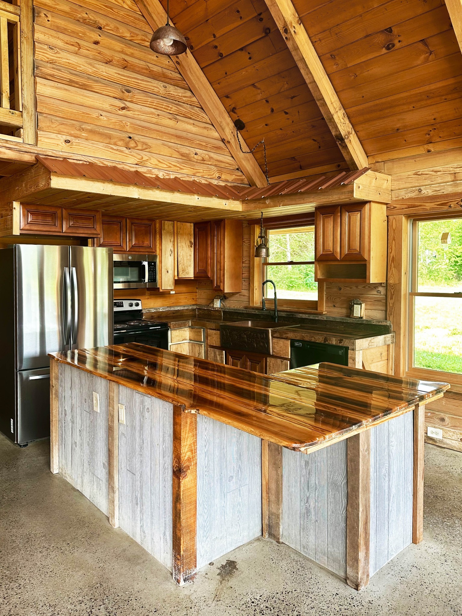 3172 Highway 76 Portland, TN 37148 - Photo 13 of 49 a kitchen with stainless steel appliances granite countertop a sink a counter space and a window