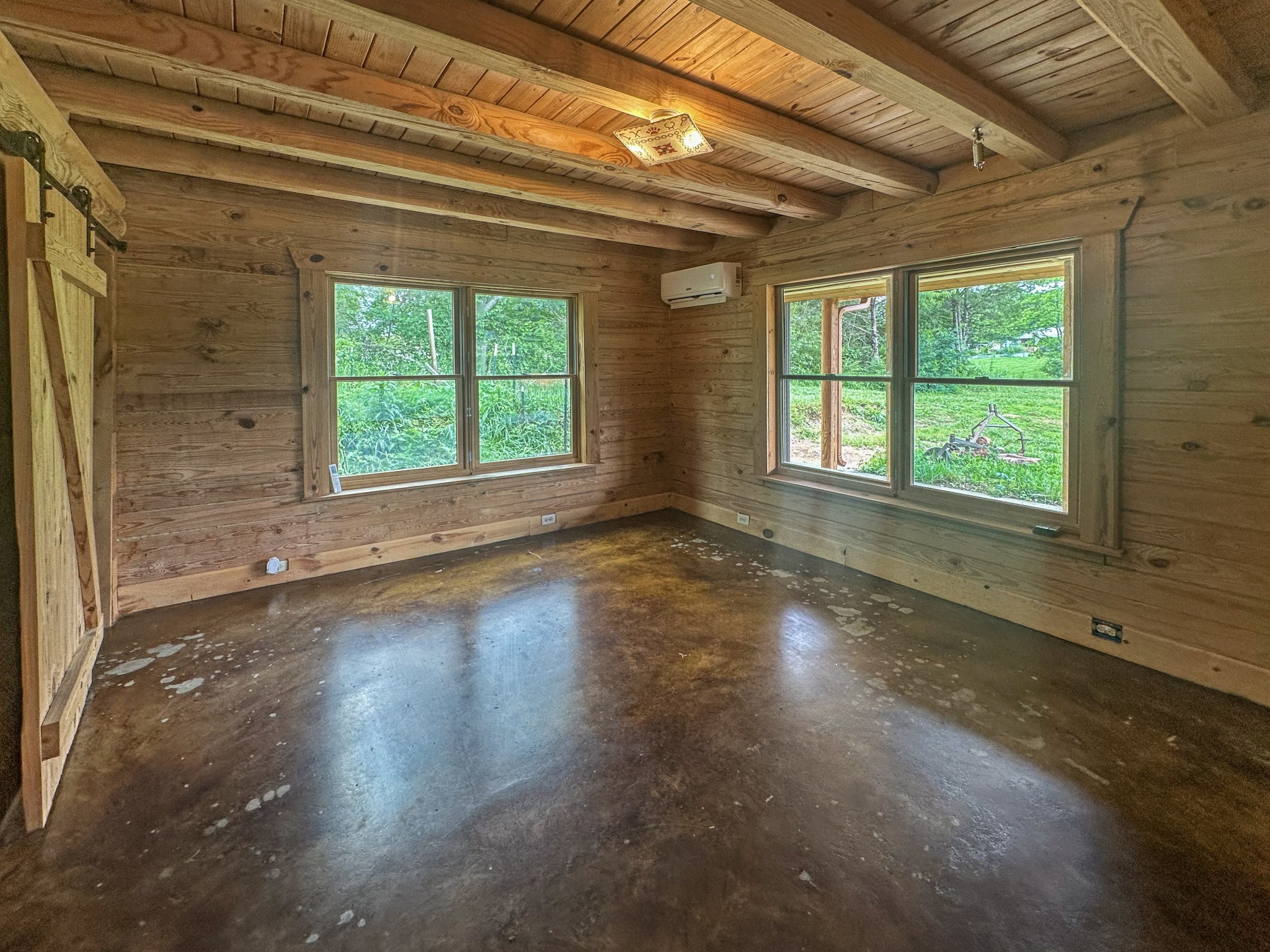 3172 Highway 76 Portland, TN 37148 - Photo 19 of 49 a view of a livingroom with wooden floor and a window