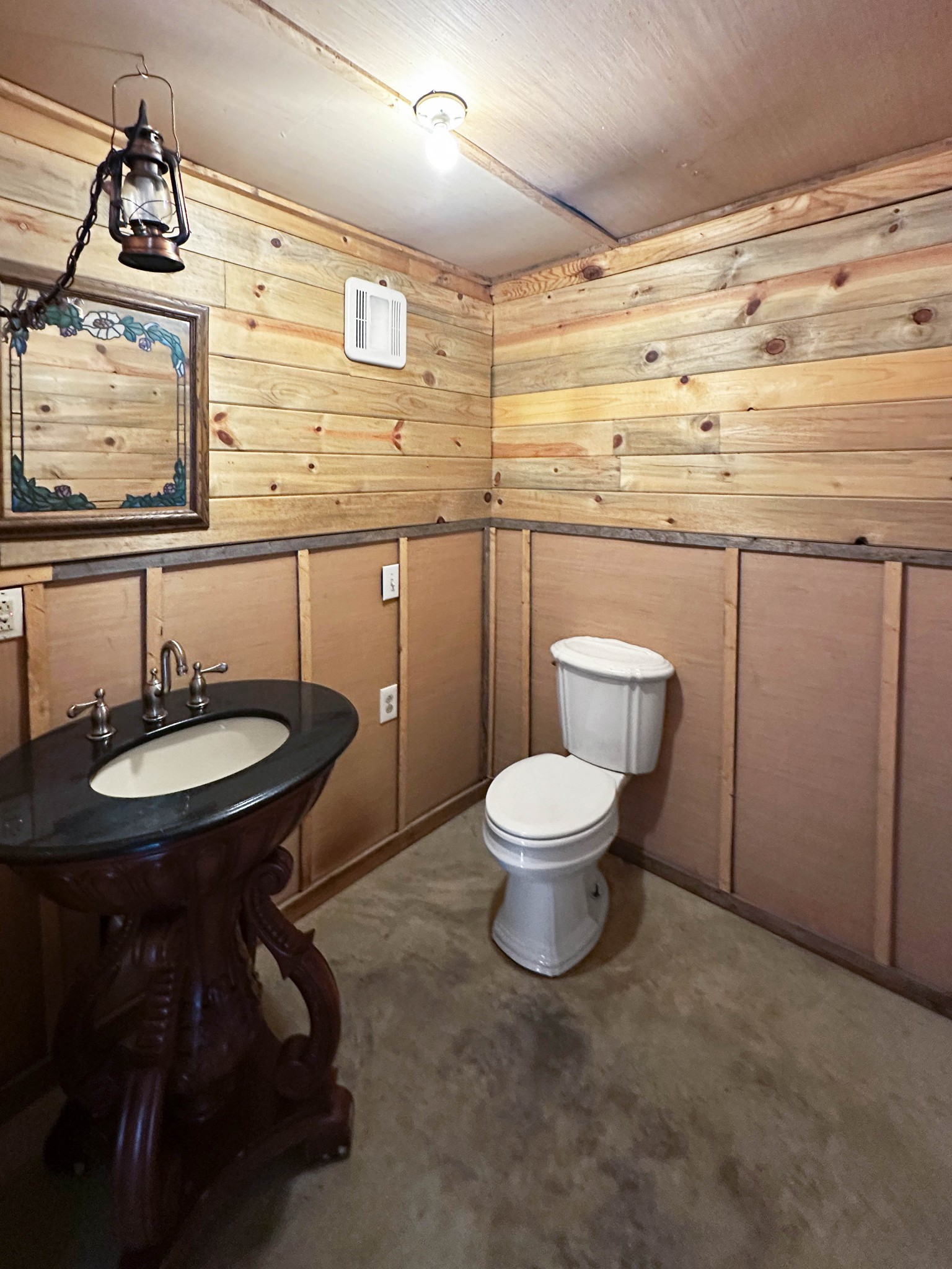 3172 Highway 76 Portland, TN 37148 - Photo 44 of 49 a bathroom with a toilet a sink and mirror