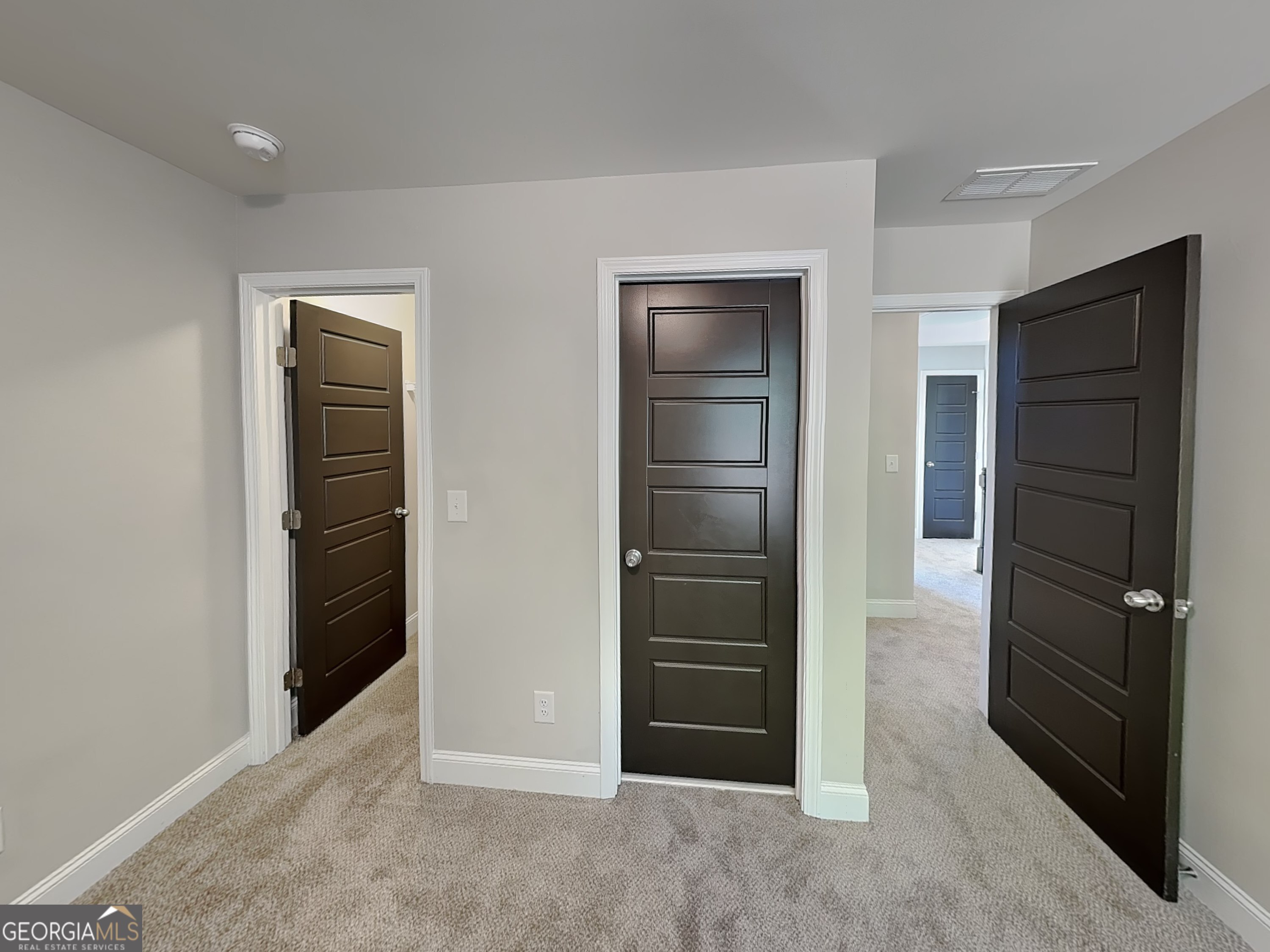 1720 Cobblefield Circle Dacula, GA 30019 - Photo 13 of 23 an empty room with closet and wooden door