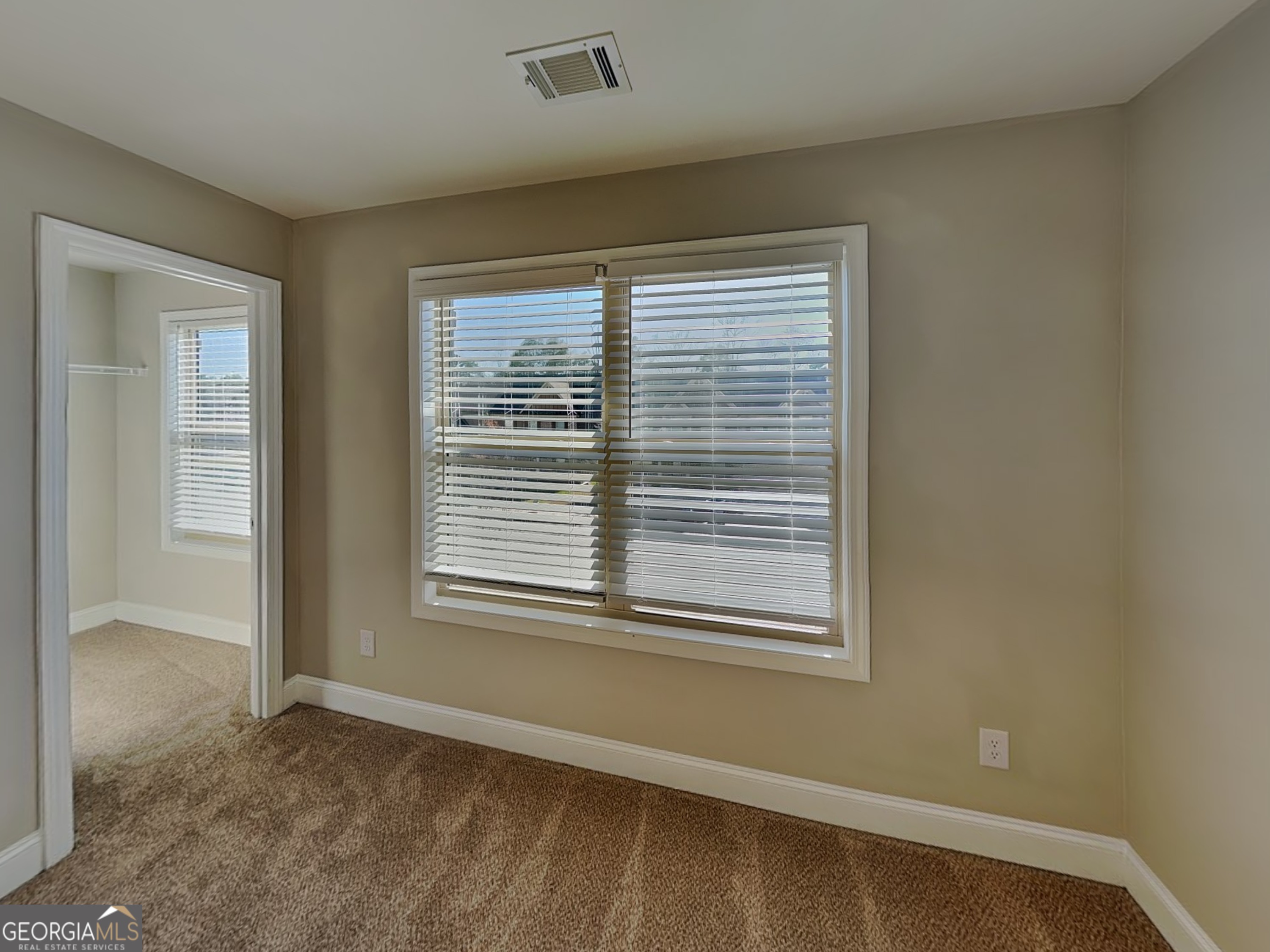 1720 Cobblefield Circle Dacula, GA 30019 - Photo 15 of 23 a view of an empty room with a window