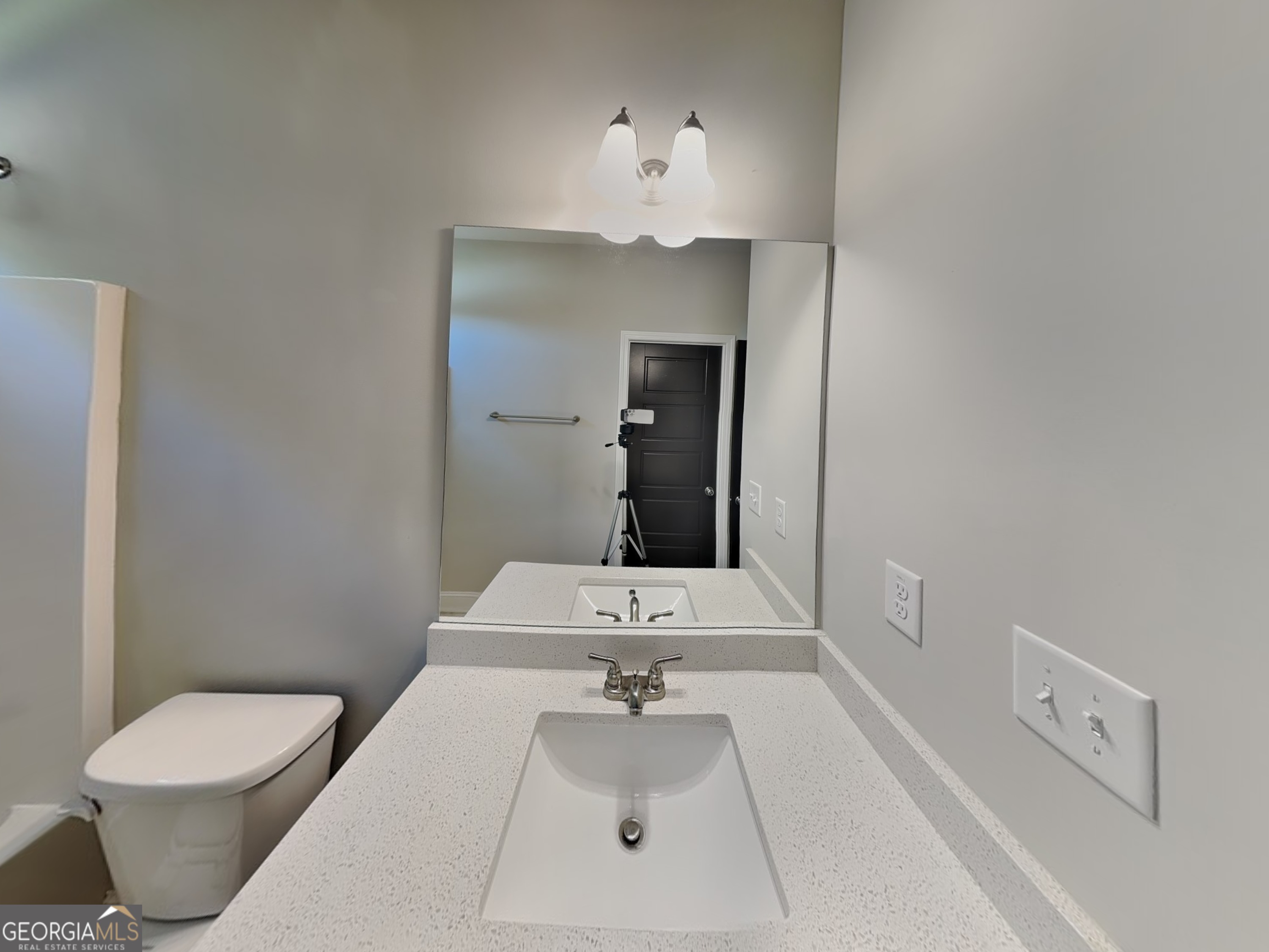 1720 Cobblefield Circle Dacula, GA 30019 - Photo 16 of 23 a bathroom with a sink vanity mirror and toilet