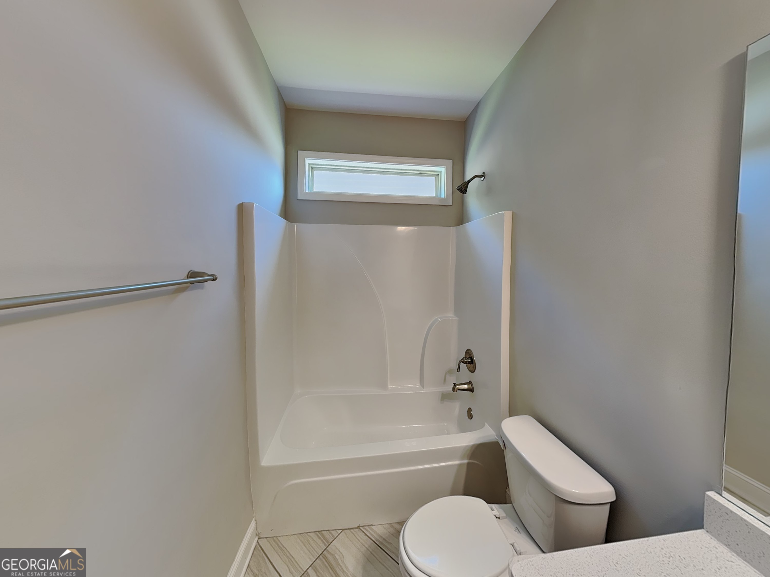 1720 Cobblefield Circle Dacula, GA 30019 - Photo 17 of 23 a bathroom with a toilet and a bath tub