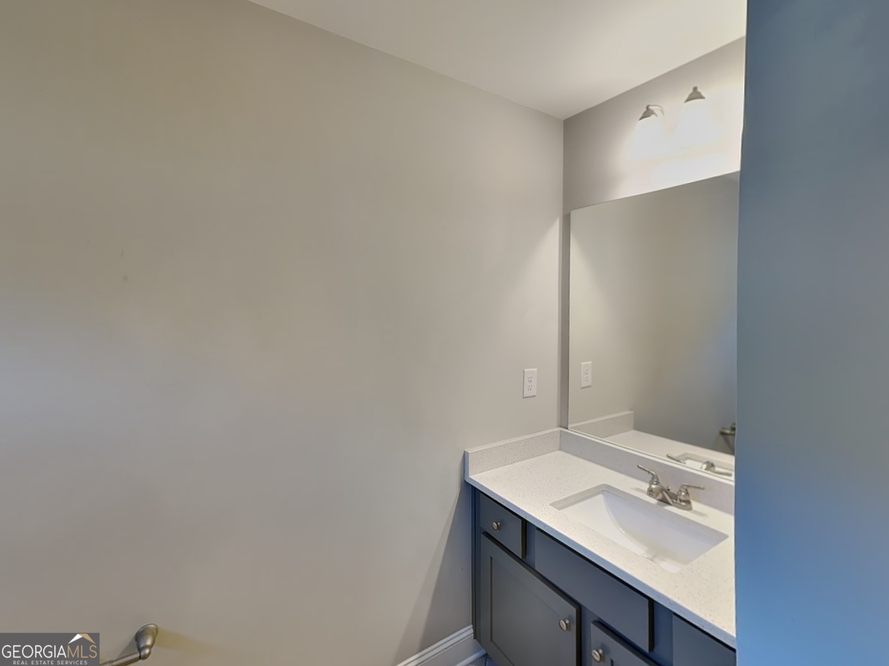 1720 Cobblefield Circle Dacula, GA 30019 - Photo 18 of 23 a bathroom with a sink and a mirror