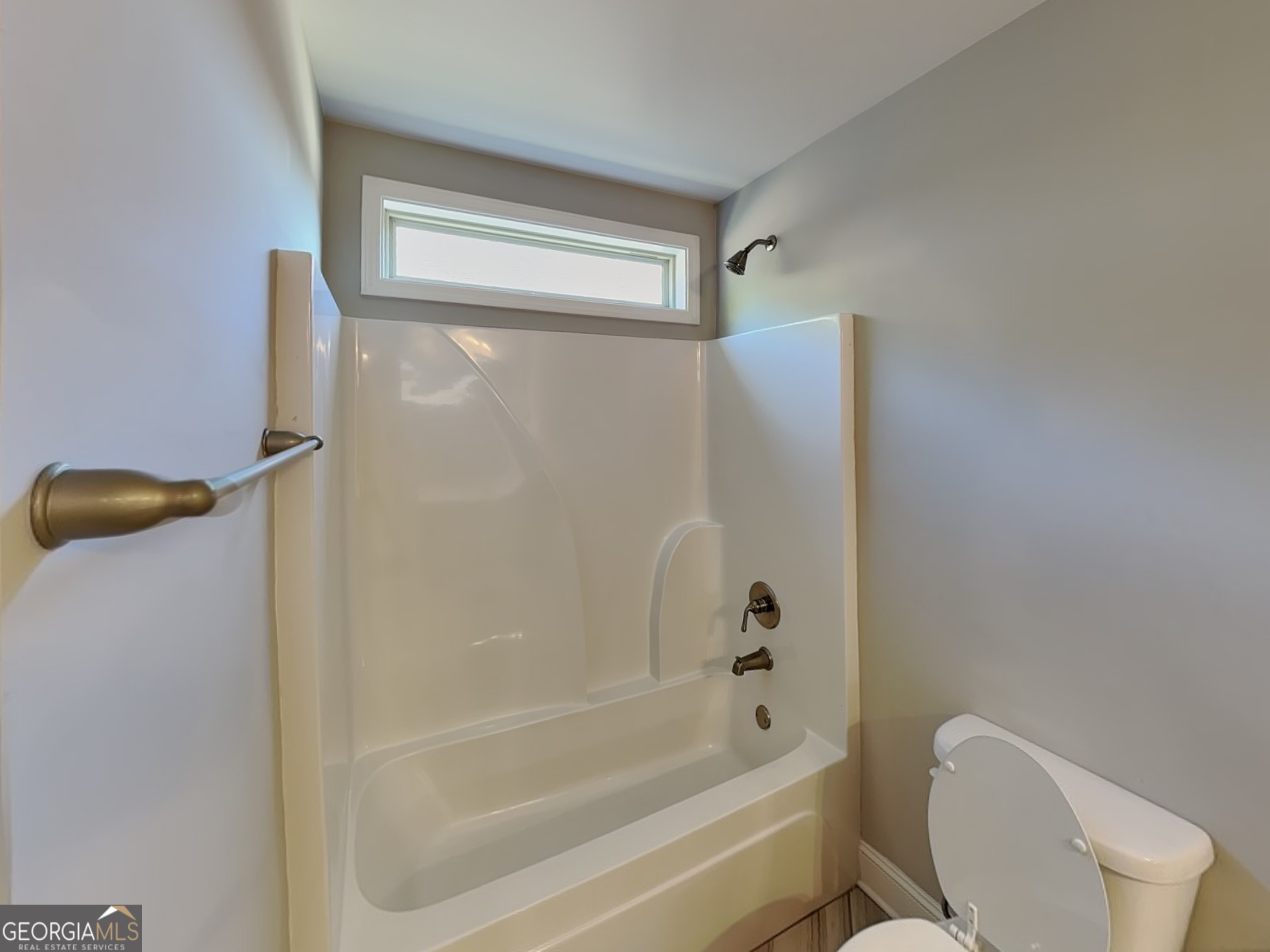 1720 Cobblefield Circle Dacula, GA 30019 - Photo 19 of 23 a bathroom with a bathtub and a shower