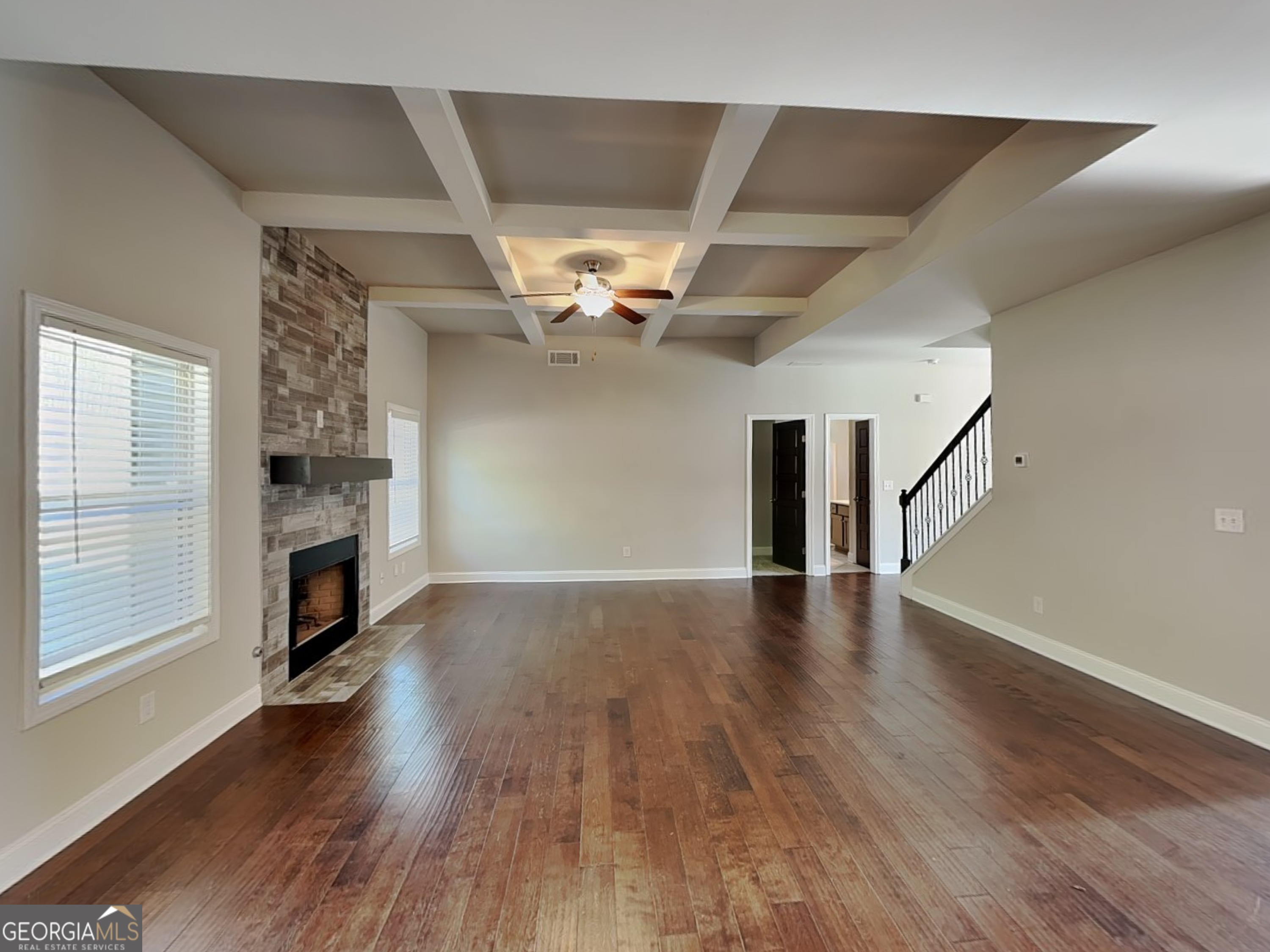 1720 Cobblefield Circle Dacula, GA 30019 - Photo 2 of 23 a view of a livingroom with wooden floor a fireplace and window