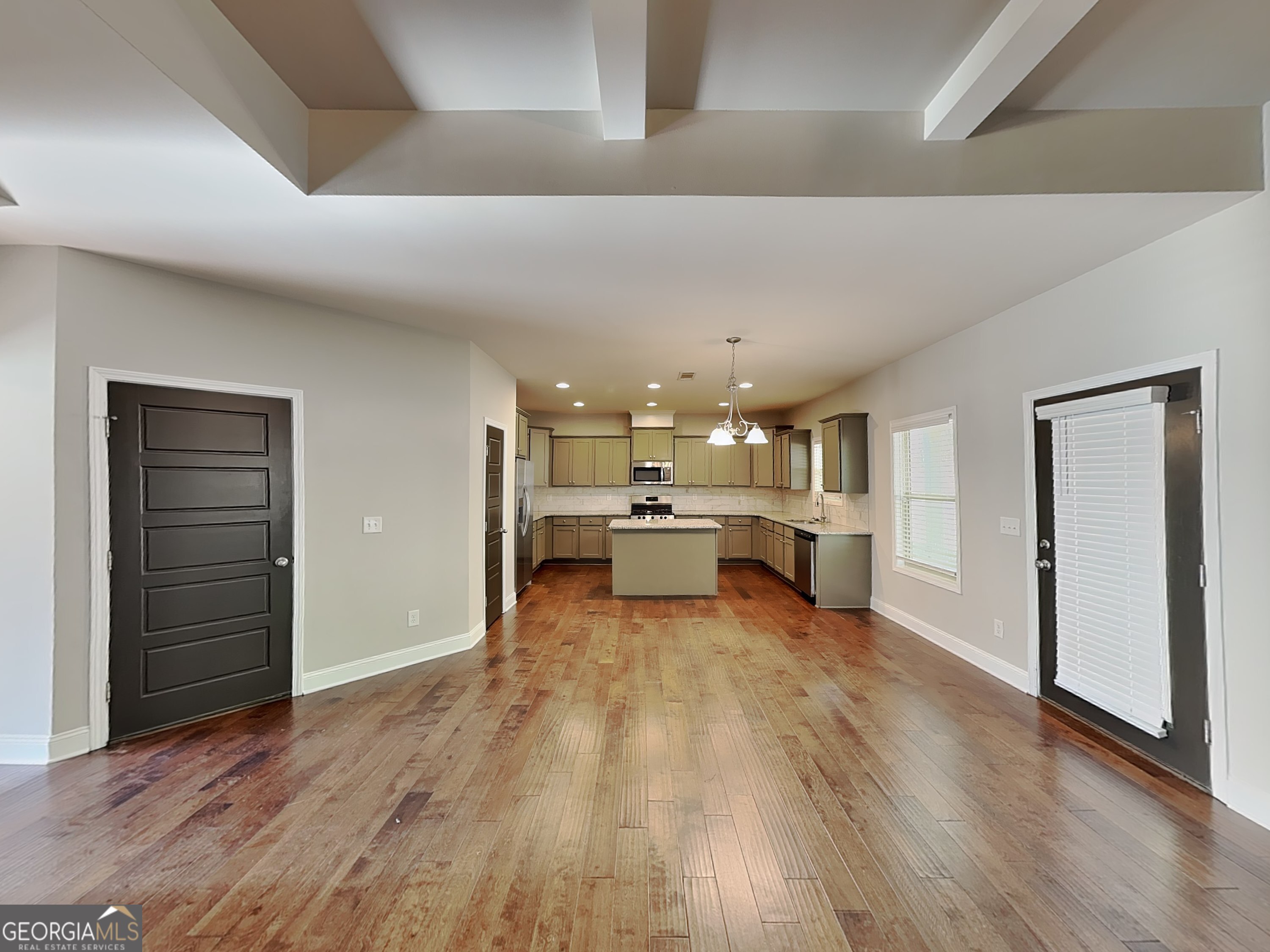 1720 Cobblefield Circle Dacula, GA 30019 - Photo 4 of 23 a view of a living room hardwood and kitchen view