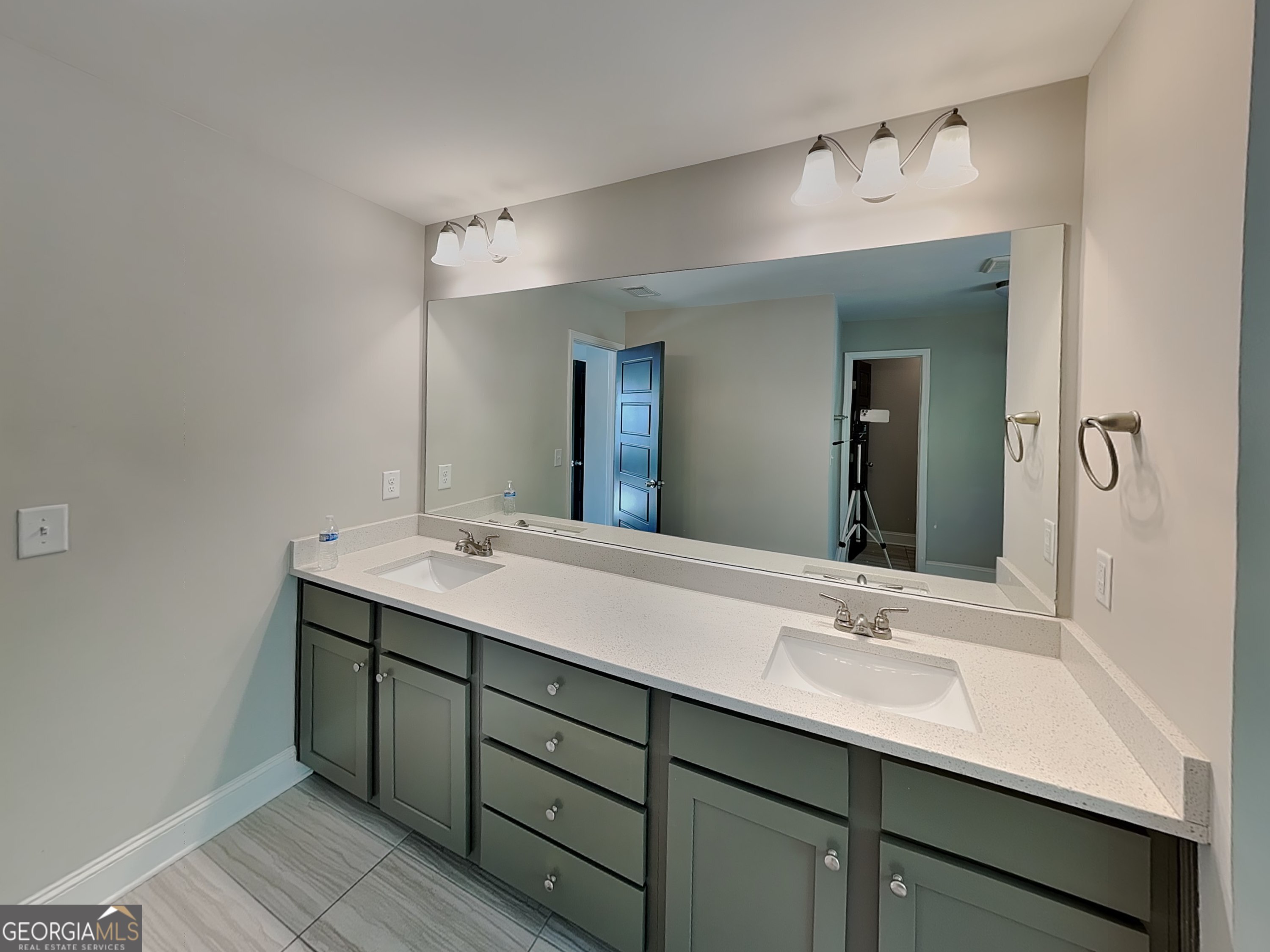 1720 Cobblefield Circle Dacula, GA 30019 - Photo 10 of 23 a bathroom with a sink double vanity and a mirror