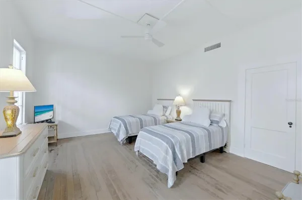 a bedroom with a bed and a lamp on table