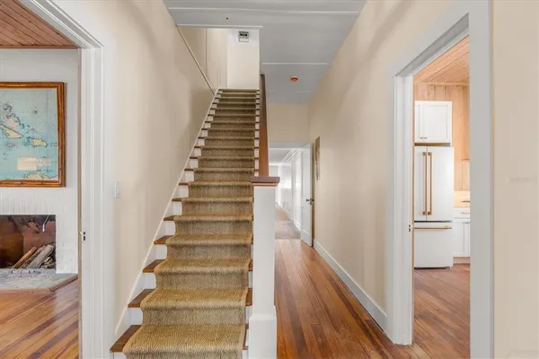 a view of an entryway with wooden floor