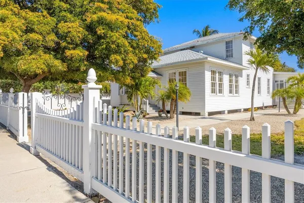 a view of a house with a small yard