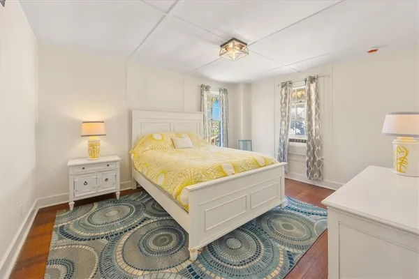 a bedroom with a sink and a mirror