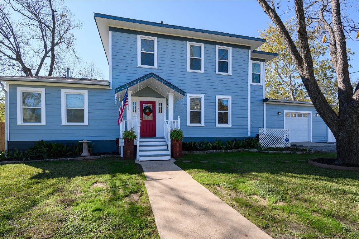 307 Walnut Drive East Austin, TX 78753 - Photo 1 of 34 a front view of a house with a yard