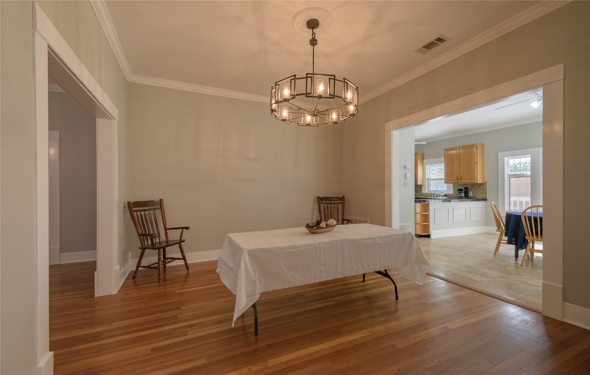 307 Walnut Drive East Austin, TX 78753 - Photo 11 of 34 a view of a dining room with furniture and wooden floor