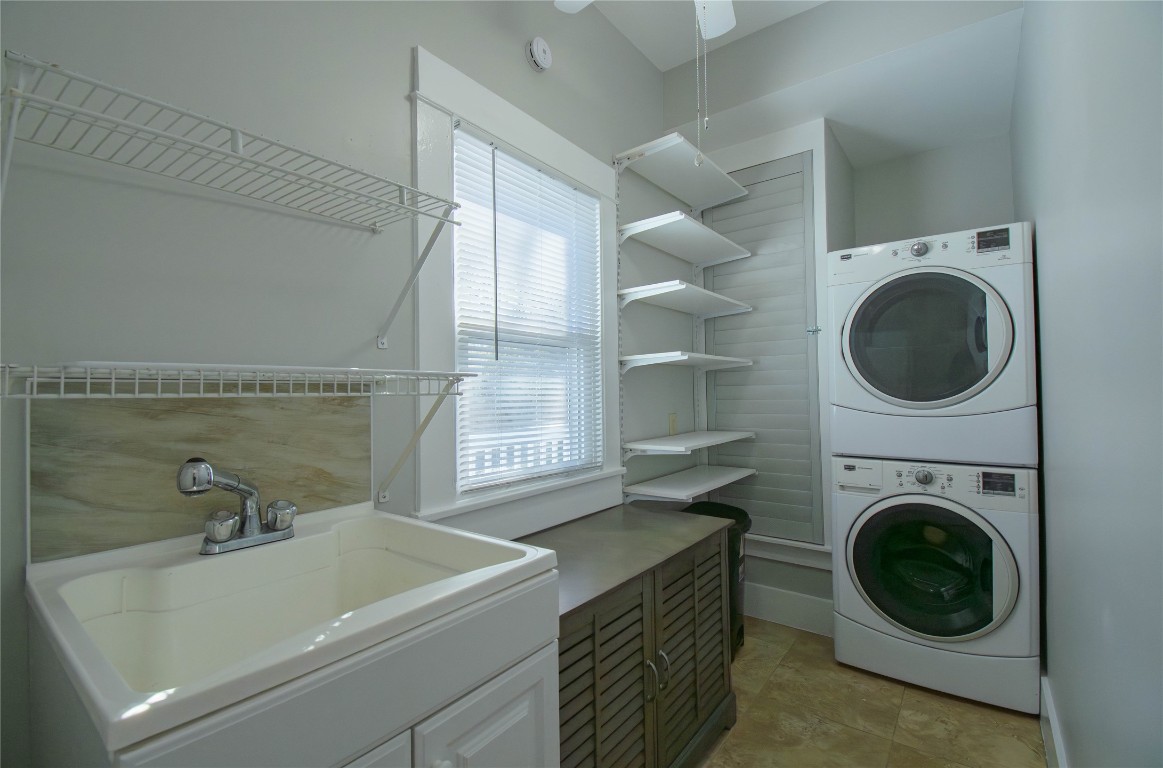 307 Walnut Drive East Austin, TX 78753 - Photo 15 of 34 a bathroom with a sink a washer and dryer