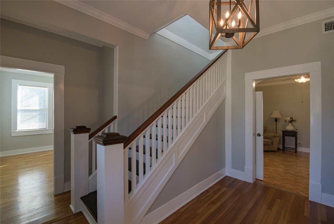 307 Walnut Drive East Austin, TX 78753 - Photo 20 of 34 a view of a hallway with wooden floor and staircase
