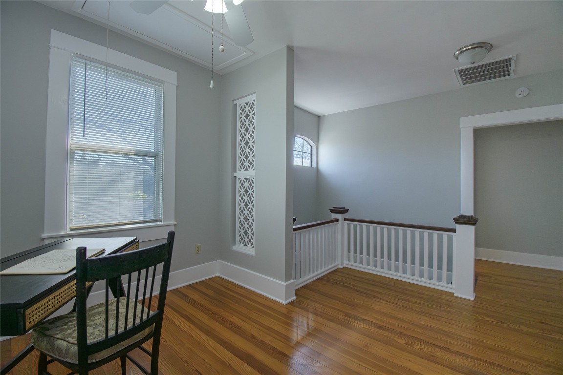 307 Walnut Drive East Austin, TX 78753 - Photo 22 of 34 a view of a hallway with wooden floor and a window