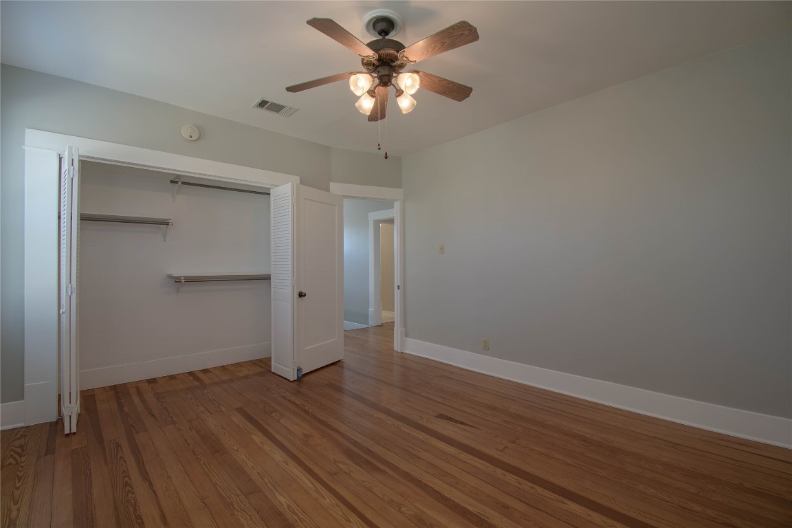 307 Walnut Drive East Austin, TX 78753 - Photo 25 of 34 a view of an empty room with wooden floor
