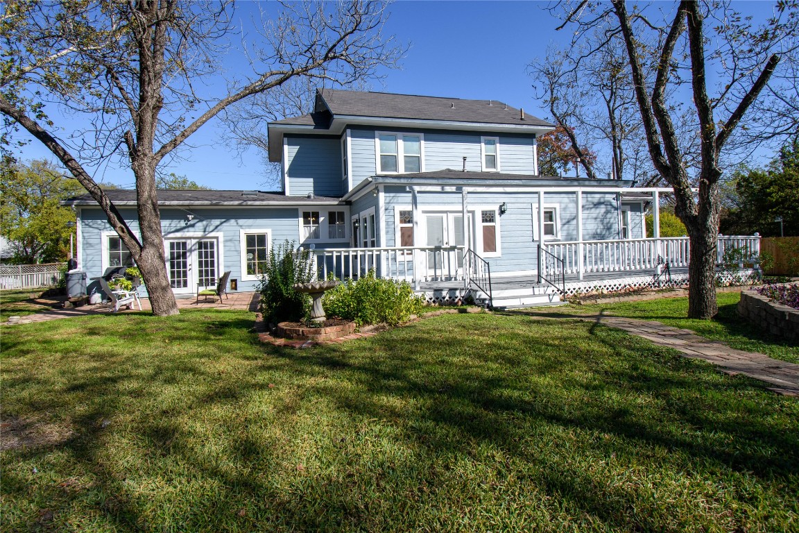 307 Walnut Drive East Austin, TX 78753 - Photo 33 of 34 a view of a house with a yard deck and a large tree