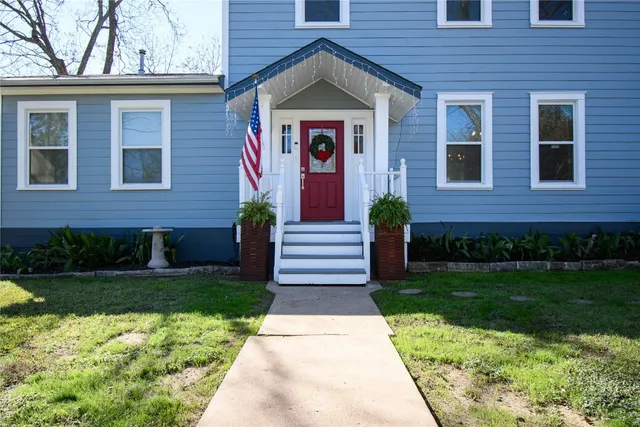 a front view of a house with garden